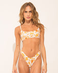 High cut bikini bottom from the Arabescos collection with orange and white arabesque print