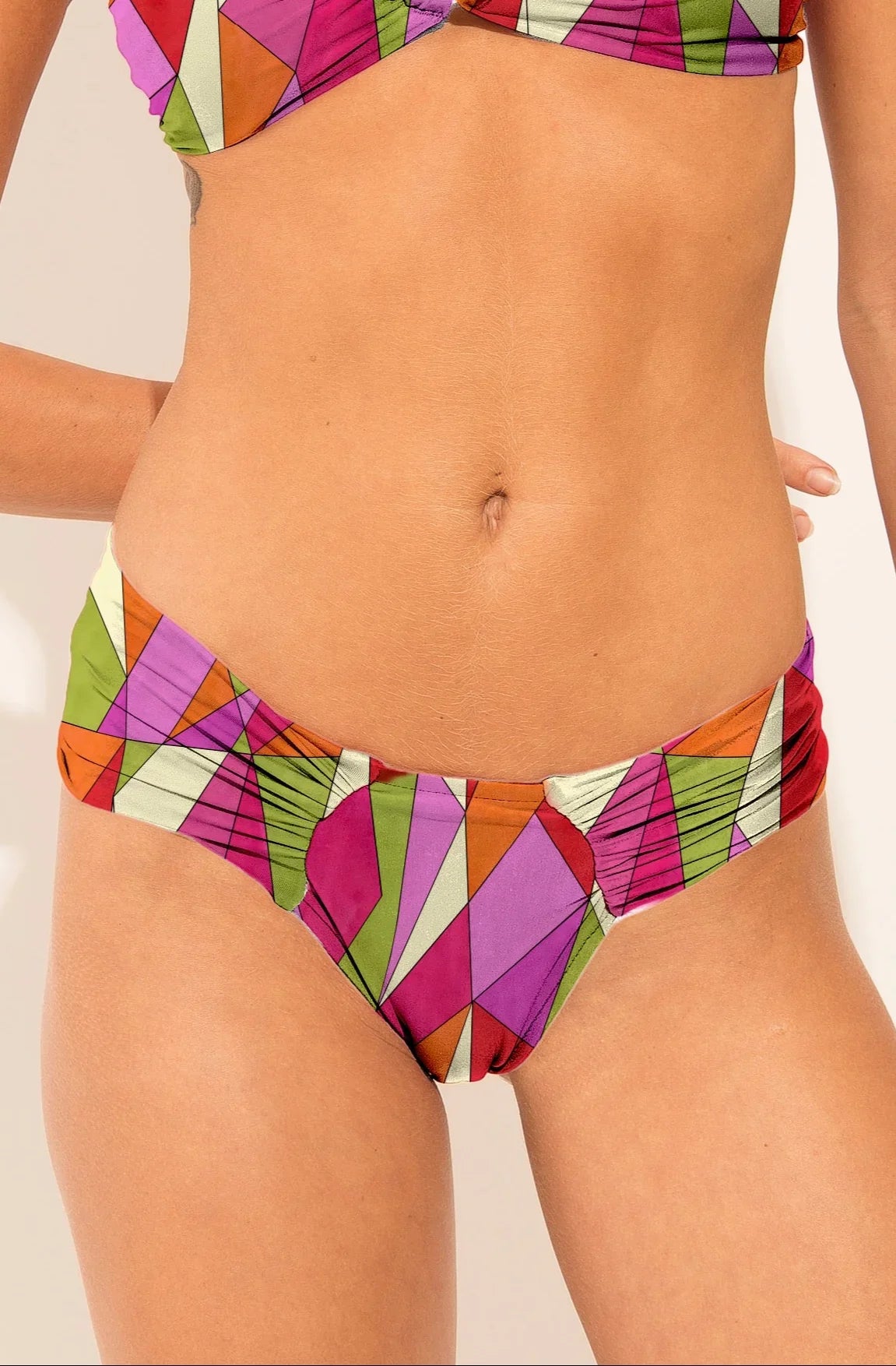 Cheeky bikini bottom from the Mosaico collection with colourful geometric print